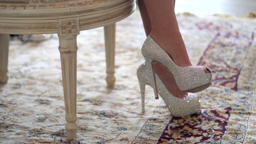 Luxury lifestyle. Rich woman legs. Lady sitting in her room