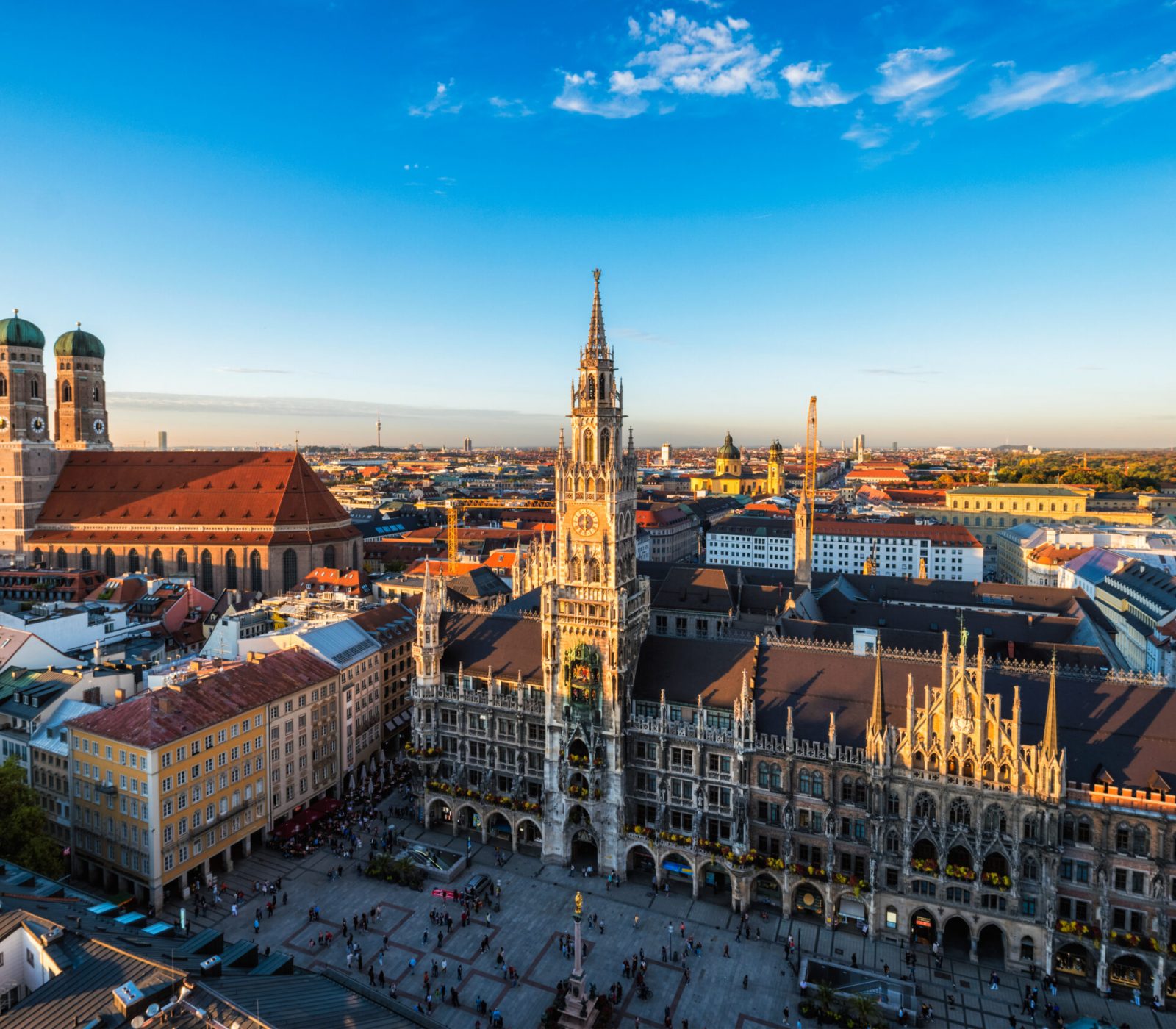 Aerial view of Munich - Marienplatz, Neues Rathaus and Frauenkirche from St. Peter's church on sunset. Munich, Germany